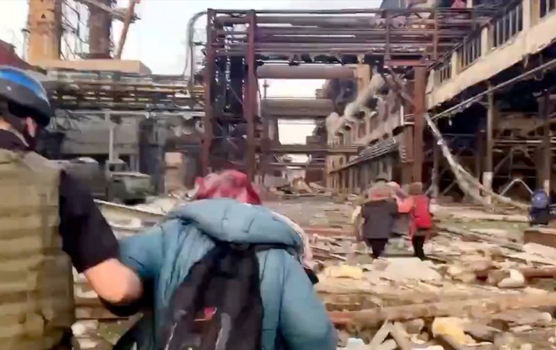 Low-res image from footage released by the Azov regiment on Sunday May 1, 2022 shows the operation to rescue people from the besieged Azovstal in southern Ukrainian port city of Mariupol. The fighters are seen taking the women and children out of the destroyed factory and handed them over to representatives of the Red Cross and the United Nations. The Azovstal plant was said to be the last area of Mariupol not under Russian control. Ukrainian President Volodymyr Zelenskyy tweeted on Sunday confirming evacuation of civilians from Azovstal had begun, saying the 1st group of about 100 people is already heading to the controlled area and will be destined in Zaporizhzhia
Azov Battalion release civilians from Azovstal plant, Mariupol, Ukraine - 01 May 2022,Image: 687809695, License: Rights-managed, Restrictions: , Model Release: no, Credit line: Profimedia