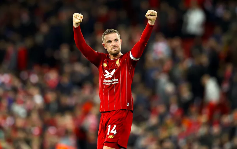 LIVERPOOL, ENGLAND - OCTOBER 27:  Jordan Henderson of Liverpool celebrates victory after the Premier League match between Liverpool FC and Tottenham Hotspur at Anfield on October 27, 2019 in Liverpool, United Kingdom. (Photo by Jan Kruger/Getty Images)