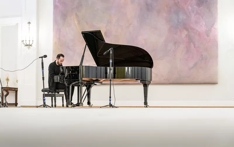April 2, 2020 - Berlin, Germany: Pianist Igor Levit gives a musical soirée at Schloss Bellevue on April 2, 2020 in Berlin, Germany. Ther German-Russian artist launched daily house concerts from his living room three weeks ago, in an act of solidarity during the pandemic, and tonight his host is the German Federal President Frank-Walter Steinmeier at Palace Bellevue. The concert is streamed on the President's Instagram., Image: 511739157, License: Rights-managed, Restrictions: , Model Release: no, Credit line: Jesco Denzel / Polaris / Profimedia