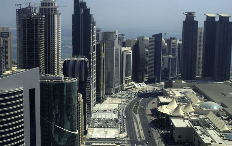 (FILES) This file photo taken on October 4, 2012 shows skyscrapers in the Qatari capital Doha.
Gulf states on June 5, 2017, cut diplomatic ties with neighbouring Qatar and kicked it out of a military coalition, less than a month after US President Donald Trump visited the region to cement ties with powerhouse Saudi Arabia.
In the region's most serious diplomatic crisis in years, Qatar's Gulf neighbours Riyadh, Bahrain and the United Arab Emirates as well as Egypt all announced they were severing ties with gas-rich Qatar. / AFP PHOTO / Patrick BAZ