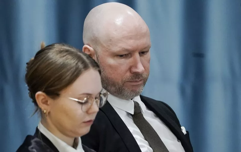 Anders Behring Breivik (R) is seen next to attorney Marte Lindholm during the first day of his trial over his prison conditions, on January 8, 2024 in Tyristrand near Oslo, Norway. Breivik, who killed 77 people in a bombing and shooting rampage in 2011 and who has been held apart from other inmates for 12 years, has sued the state for a second time arguing that his isolation is a violation of the European Convention on Human Rights. (Photo by Cornelius Poppe / NTB / AFP) / Norway OUT