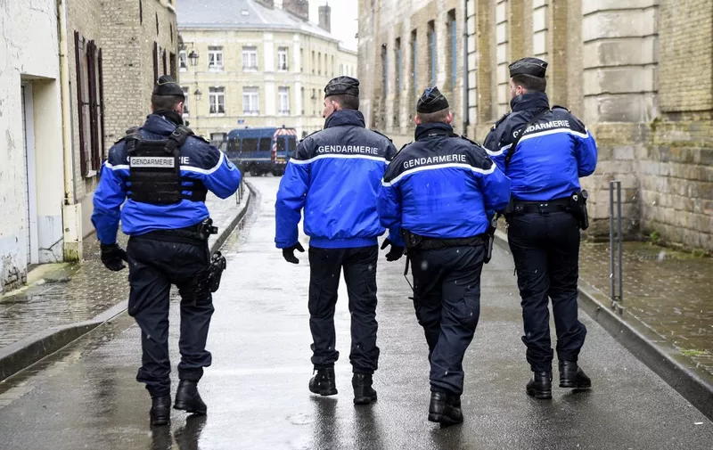 French police officers patrol the surroundings of the Saint-Omer court on February 27, 2020, during the appeal trial of Redoine Faid for the robbery of an armoured van near Arras in 2011. (Photo by FRANCOIS LO PRESTI / AFP)