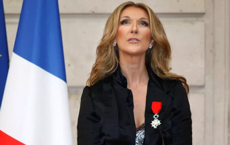 Canadian singer Celine Dion looks on after she was awarded with the France's Legion d'Honneur during a ceremony at the Elysee Palace in Paris on May 22, 2008. AFP PHOTO POOL CHARLES PLATIAU / AFP / POOL / CHARLES PLATIAU