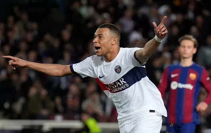 PSG's Kylian Mbappe celebrates after scoring his side's third goal during the Champions League quarterfinal second leg soccer match between Barcelona and Paris Saint-Germain at the Olimpic Lluis Companys stadium in Barcelona, Spain, Tuesday, April 16, 2024. (AP Photo/Emilio Morenatti)