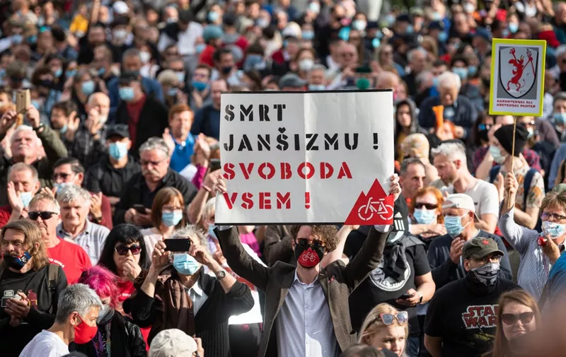People take part in an anti-government protest in Ljubljana on May 28, 2021. (Photo by Jure Makovec / AFP)