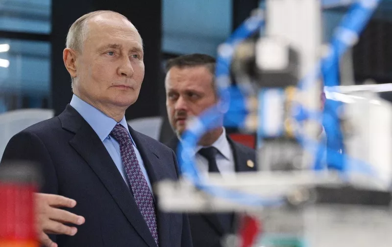 In this pool photograph distributed by Sputnik agency, Russian President Vladimir Putin looks on as he visits the Innovative Science and Technology centre in Veliky Novgorod on September 21, 2023. (Photo by Ramil SITDIKOV / POOL / AFP)