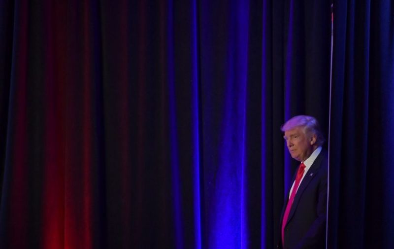 Republican presidential elect Donald Trump arrive to speak during election night at the New York Hilton Midtown in New York on November 9, 2016.  / AFP PHOTO / JIM WATSON