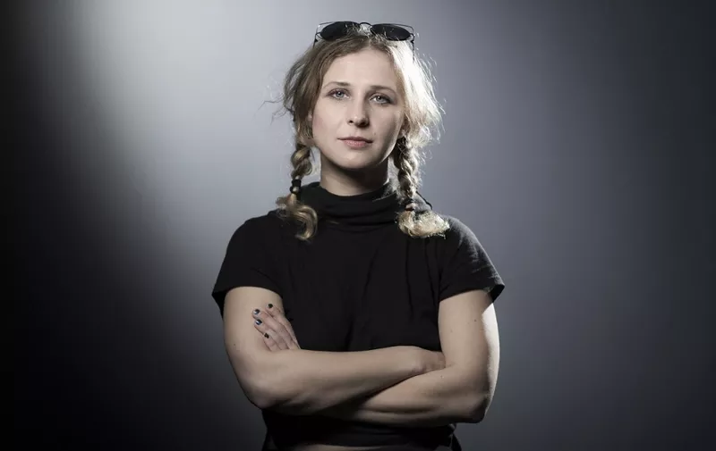 (FILES) In this file photo taken on October 04, 2017 Russian political activist and member of the anti-Putinist punk rock group Pussy Riot, Maria Vladimirovna "Masha" Alekhina, also known as Maria Alyokhina, poses during a photo session in Paris. - Pussy Riot member Maria Alyokhina has left Russia, she said in an interview, after disguising herself as a food delivery courier to escape police. Alyokhina joins thousands of Russians who have fled their country since President Vladimir Putin sent troops into Ukraine on February 24. (Photo by JOEL SAGET / AFP)