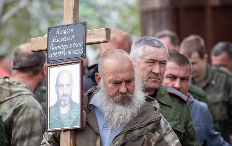 LUGANSK, LUGANSK PEOPLE'S REPUBLIC - APRIL 19, 2022: Servicemen of the People's Militia of the Lugansk People's Republic attend a farewell ceremony for Lt Col Mikhail Kishchik, commander of the 11th territorial defence battalion, codenamed Chechen, on the Avenue of Glory. Kishchik was killed while breaking out of encirclement outside Kreminna, 95km northwest of Lugansk. Alexander Reka/TASS,Image: 684312397, License: Rights-managed, Restrictions: , Model Release: no, Credit line: Profimedia
