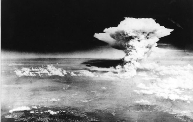 TO GO WITH AFP STORY "JAPAN-US-NUCLEAR-HISTORY-WWII-HIROSHIMA-ANNIVERSARY" BY HIROSHI HIYAMA
This handout picture taken on August 6, 1945 by US Army and released from Hiroshima Peace Memorial Museum shows a mushroom cloud of the atomic bomb dropped by B-29 bomber Enola Gay over the city of Hiroshima. Charred bodies bobbed in the brackish waters that flowed through Hiroshima 70 years ago this week, after a once-vibrant Japanese city was consumed by the searing heat of the world's first nuclear attack. About 140,000 people are estimated to have been killed in the attack, including those who survived the bombing itself but died soon afterward due to severe radiation exposure.  AFP PHOTO / HIROSHIMA PEACE MEMORIAL PARK---EDITORS NOTE---HANDOUT RESTRICTED TO EDITORIAL USE - MANDATORY CREDIT "AFP PHOTO / HIROSHIMA PEACE MEMORIAL MUSEUM" - NO MARKETING NO ADVERTISING CAMPAIGNS - DISTRIBUTED AS A SERVICE TO CLIENTS