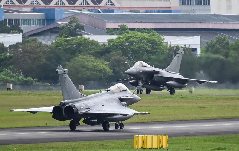 French Air Force Dassault Rafale multirole combat aircrafts prepare for take-off as part of the Rastaban force projection mission at Paya Lebar airbase in Singapore on January 20, 2023. (Photo by Roslan RAHMAN / AFP)