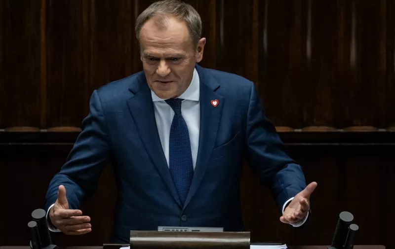 Designated Polish Prime Minister Donald Tusk gives a speech to present his programme to lawmakers at the Polish Parliament in Warsaw, Poland on December 12, 2023. Polish lawmakers will vote on the proposed new government of Donald Tusk, whose pro-EU administration is expected to garner enough support to put an end to eight years of right-wing populist rule. The lower house of parliament, which is controlled by Tusk's multi-party alliance, will hold the confidence vote after the veteran politician and former EU chief presented his programme. (Photo by Wojtek Radwanski / AFP)