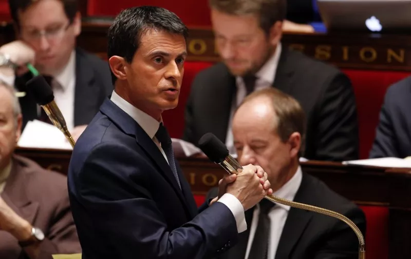 French Prime Minister Manuel Valls speaks during a debate on a measure that would extend a state of emergency declared by the French president until the end of February, at the National Assembly in Paris on November 19, 2015. A state of emergency was declared across the country after the terrorist attacks of November 13 that left 129 people dead and 350 injured. AFP PHOTO / FRANCOIS GUILLOT / AFP / FRANCOIS GUILLOT