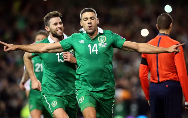 Ireland's striker Jonathan Walters (C) celebrates after scoring his team's first goal from a penalty during a UEFA Euro 2016 Group D qualifying second leg play-off football match between Ireland and Bosnia Herzegovina at the Aviva stadium in Dublin on November 16, 2015.  AFP PHOTO / PAUL FAITH
