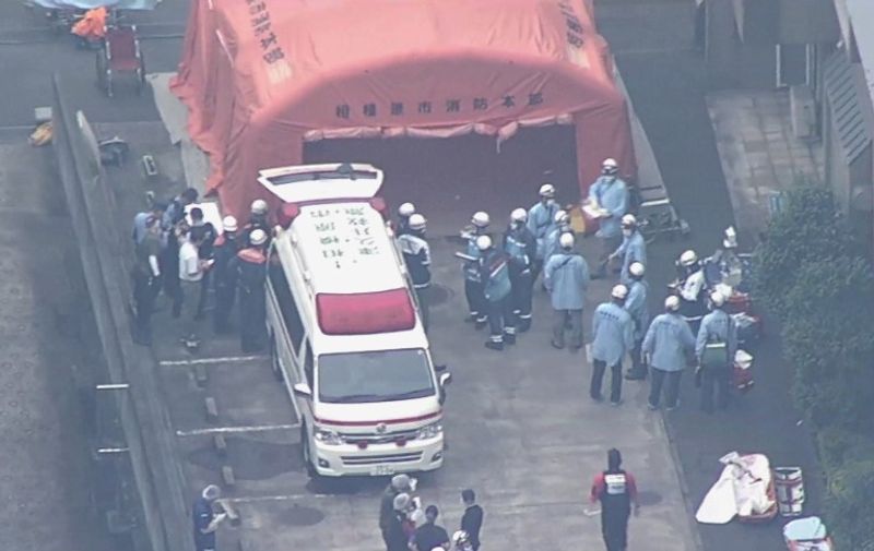 This video frame grab taken from footage supplied by Japanese broadcaster TBS on July 26, 2016 shows rescue personnel outside the Tsukui Yamayuri En care centre where a knife-wielding man went on a rampage in the city of Sagamihara, Kanagawa prefecture, some 50 kms (30 miles) west of Tokyo.  JAPAN OUT
A 26-year-old knife-wielding former employee killed 19 people and injured 25 at the care centre for the mentally disabled early on July 26, in the country's worst mass killing in decades. / AFP PHOTO / TBS / TBS /  - Japan OUT / -----EDITORS NOTE --- RESTRICTED TO EDITORIAL USE - MANDATORY CREDIT "AFP PHOTO / TBS" - NO MARKETING - NO ADVERTISING CAMPAIGNS - DISTRIBUTED AS A SERVICE TO CLIENTS - NO ARCHIVES