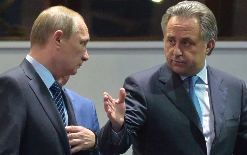 Russian President Vladimir Putin (L) listens to Sports Minister Vitaly Mutko as they visit a sports centre in Sochi on November 11, 2015. Vladimir Putin on November 11 ordered an inquiry into allegations of "state-supported" drug abuse in athletics that have left Russia facing a possible Olympics ban, but insisted any punishment should be individual and not collective. AFP PHOTO / RIA NOVOSTI / ALEXEI DRUZHININ