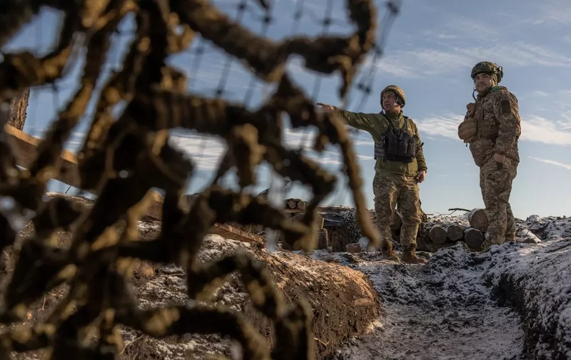 Ukrainian soldiers of the 41st brigade stand on a position near the frontline, outside Kupiansk, Kharkiv region, on January 23, 2024, amid the Russian invasion of Ukraine. (Photo by Roman PILIPEY / AFP)
