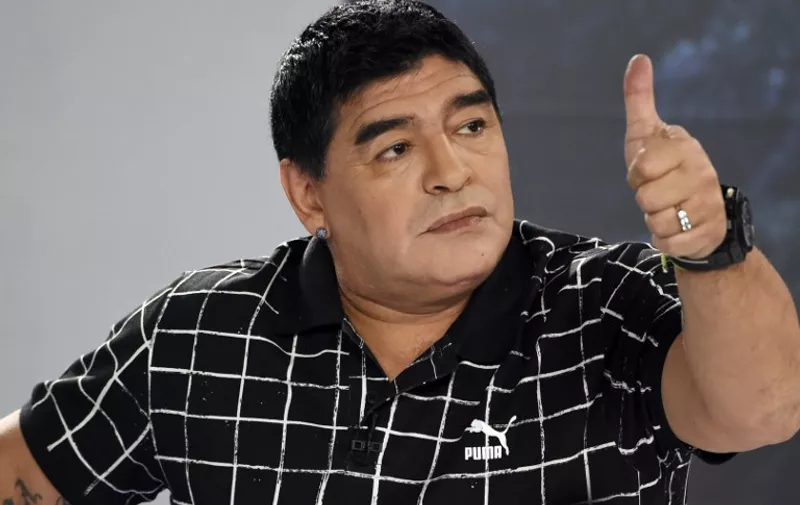 (FILES) - A picutre taken on February 28, 2015, shows Argentinean former football player Diego Maradona gesturing while taking part in a TV program in Caracas. Diego Maradona will stand for the presidency of scandal-tainted FIFA presidency, a Uruguayan journalist who presents a television show with the Argentine football legend, said on June 22, 2015.
  AFP  PHOTO/ Juan Barreto