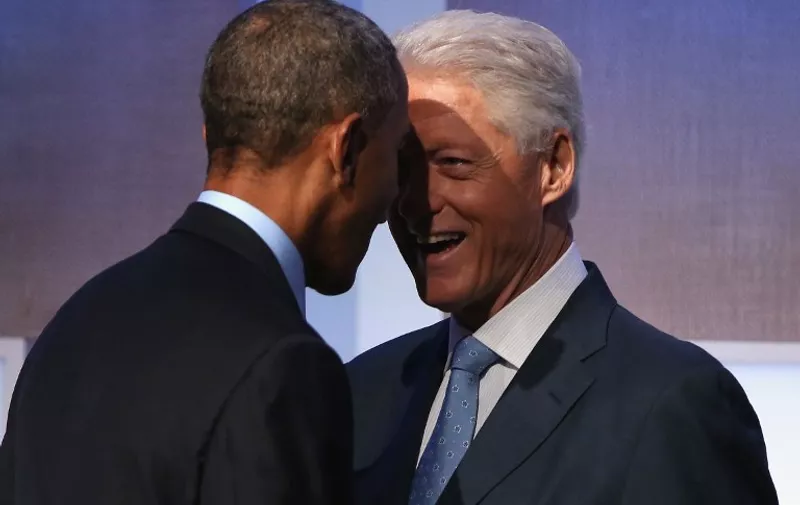 NEW YORK, NY - SEPTEMBER 23: U.S. President Barack Obama and Former U.S. President Bill Clinton speak before Obama's speech at the Clinton Global Initiative (CGI), on September 23, 2014 in New York City. The annual meeting, established in 2005 by President Clinton, convenes global leaders to discuss solutions to world problems.   John Moore/Getty Images/AFP