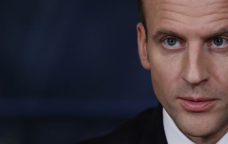 French President Emmanuel Macron addresses the medias after the signing of a new law on orientation choices for the success of students at the Elysee Palace in Paris, on March 8, 2018. (Photo by CHRISTIAN HARTMANN / AFP)