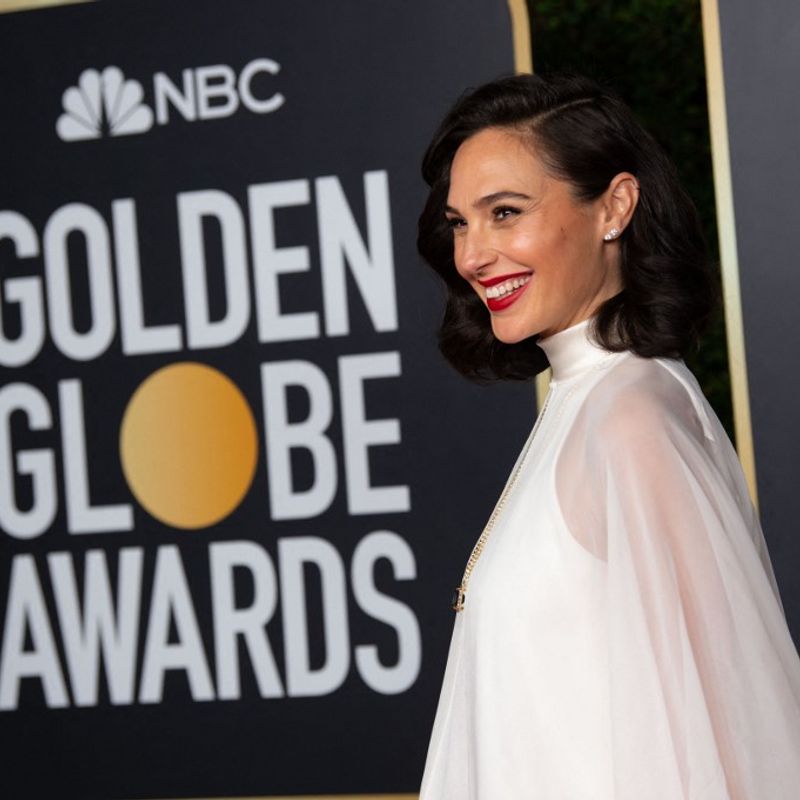This handout photo courtesy of the HFPA shows Gal Gadot arriving for the 78th Annual Golden Globe Awards in Beverly Hills, California on February 27, 2021. - Usually a star-packed, laid-back party that draws Tinseltown's biggest names to a Beverly Hills hotel ballroom, this pandemic edition will be broadcast from two scaled-down venues, with frontline and essential workers among the few in attendance. (Photo by - / HFPA / AFP) / RESTRICTED TO EDITORIAL USE - MANDATORY CREDIT "AFP PHOTO / HFPA " - NO MARKETING - NO ADVERTISING CAMPAIGNS - DISTRIBUTED AS A SERVICE TO CLIENTS