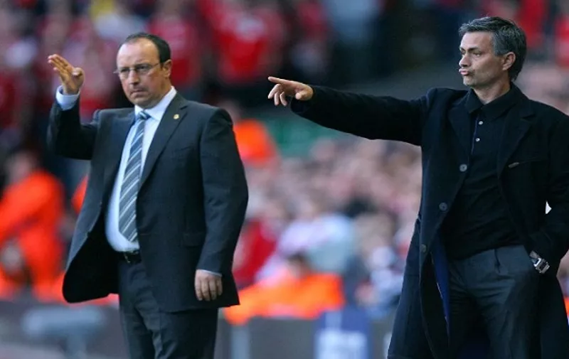 Liverpool's Spanish manager Rafael Benitez (L) and Chelsea's Portuguese manager Jose Mourinho give instructions to their players during their European Champions League semi final second leg football match at Anfield, Liverpool, north west England, 01 May 2007. 
AFP PHOTO / CARL DE SOUZA