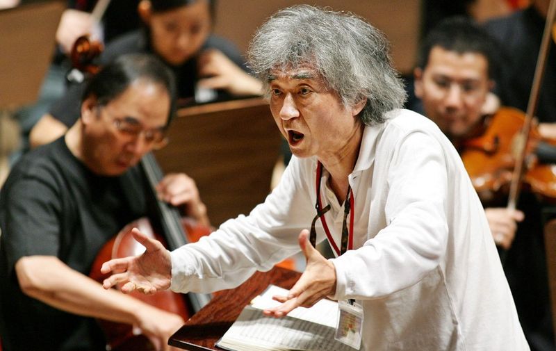 (FILES) This file photo taken on July 19, 2006 shows Japanese conductor Seiji Ozawa conducting a performance of Mahler's Symphony No. 2 ''Resurrection'' during a rehearsal at the Aichi Prefectural Theater in Nagoya, central Japan. Media reports said on February 9, 2024 that Japanese star conductor Seiji Ozawa has died at the age of 88. (Photo by JIJI PRESS / AFP) / Japan OUT