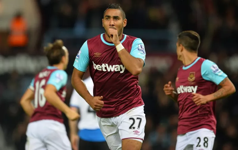 West Ham United's French midfielder Dimitri Payet celebrates scoring his second goal during the English Premier League football match between West Ham United and Newcastle United at The Boleyn Ground in Upton Park, East London on September 14, 2015.   AFP PHOTO / GLYN KIRK


RESTRICTED TO EDITORIAL USE. NO USE WITH UNAUTHORIZED AUDIO, VIDEO, DATA, FIXTURE LISTS, CLUB/LEAGUE LOGOS OR 'LIVE' SERVICES. ONLINE IN-MATCH USE LIMITED TO 75 IMAGES, NO VIDEO EMULATION. NO USE IN BETTING, GAMES OR SINGLE CLUB/LEAGUE/PLAYER PUBLICATIONS.