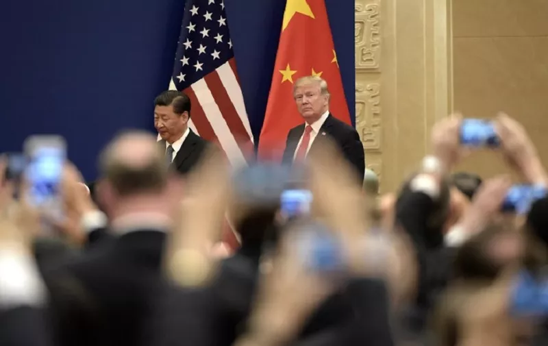 US President Donald Trump and Chinese President Xi Jinping attend a business meeting at the Great Hall of the People in Beijing on November 9, 2017.
Donald Trump and Xi Jinping put their professed friendship to the test on November 9 as the least popular US president in decades and the newly empowered Chinese leader met for tough talks on trade and North Korea. / AFP PHOTO / FRED DUFOUR