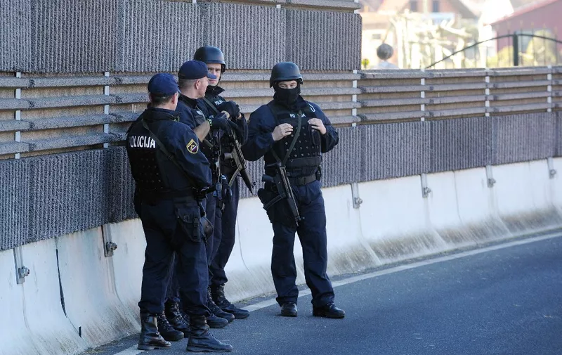 Slovenian special police forces stand after been deployed in the disputed area near the Harmica-Rigonce crossing, on November 12,2015. Slovenia found itself on the Balkans route taken by thousands of migrants heading to northern Europe after Hungary sealed its borders with Croatia and Serbia and began erecting razor wire along the border with fellow European Union member Croatia on November 11, in a move the government says will help it better manage a record influx of migrants. Croatia's foreign ministry lodged a "strong protest" with Slovenia's embassy in Zagreb for laying the wire on what it said was Croatian territory near the Harmica-Rigonce border crossing and urged Ljubljana to "remove it as soon as possible.". AFP PHOTO/STRINGER (Photo by AFP)