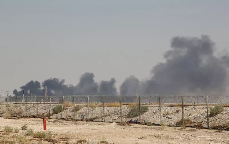 Smoke billows from an Aramco oil facility in Abqaiq about 60km (37 miles) southwest of Dhahran in Saudi Arabia's eastern province on September 14, 2019. - Drone attacks sparked fires at two Saudi Aramco oil facilities early today, the interior ministry said, in the latest assault on the state-owned energy giant as it prepares for a much-anticipated stock listing. Yemen's Iran-aligned Huthi rebels claimed the drone attacks, according to the group's Al-Masirah television. (Photo by - / AFP)