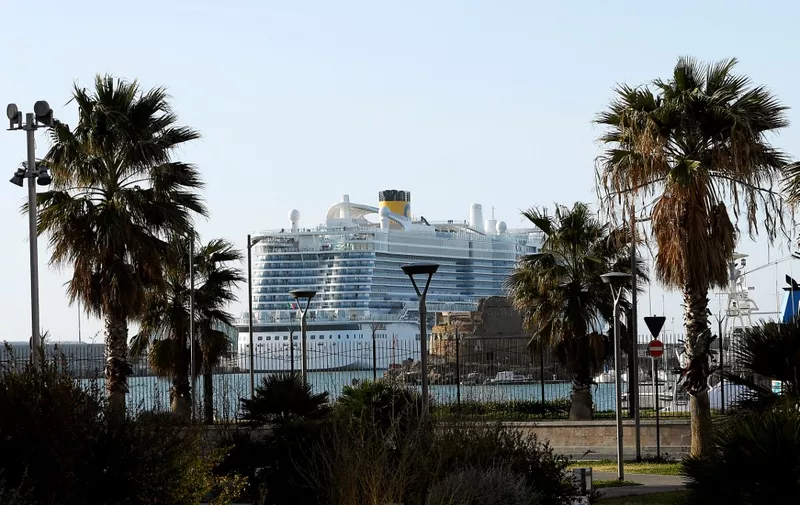The Costa Smeralda cruise ship is docked in the Civitavecchia port 70km north of Rome on January 30, 2020. More than 6,000 tourists were under lockdown aboard the cruise ship after two Chinese passengers were isolated over fears they could be carrying the coronavirus. - Samples from the two passengers were sent for testing after three doctors and a nurse boarded the Costa Crociere ship in the port of Civitavecchia to tend to a woman running a fever, the local health authorities said. (Photo by Filippo MONTEFORTE / AFP)