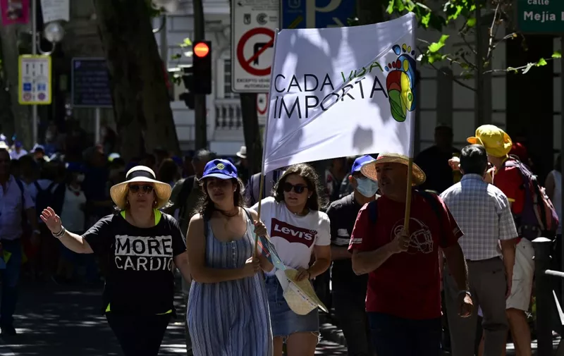Demonstrators hold flags reading "Every life matters" as they take part in a protest against abortion in Madrid on June 26, 2022, after the US Supreme Court's overturned America's constitutional right to abortion, on June 24, 2022. (Photo by JAVIER SORIANO / AFP)