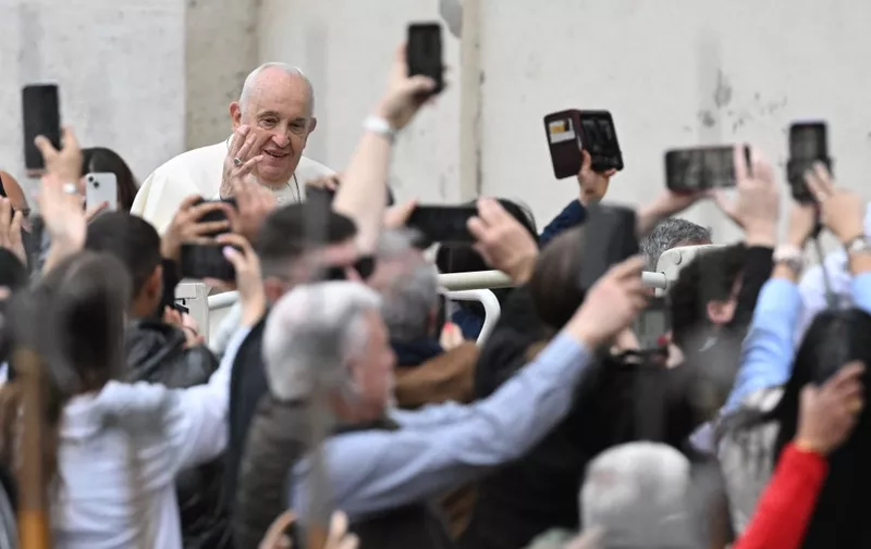 Pope Francis waves to the crowd from the popemobile after the Easter Mass as part of the Holy Week celebrations, at St Peter's square in the Vatican on March 31, 2024. (Photo by Tiziana FABI / AFP)
