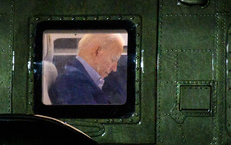 US President Joe Biden is seen onboard Marine One upon arrival at New Castle Airport in New Castle, Delaware on July 23, 2021. - Biden is scheduled to spend the weekend at his Wilmington, Delaware residence. (Photo by MANDEL NGAN / AFP)