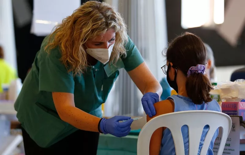 A nurse vaccinates a girl while the COVID-19 vaccination goes on for children and young people in Granada, Spain on September 03, 2021.
Children and young people COVID-19 vaccination continues in Andalucia, Spain, Granada - 03 Sep 2021,Image: 630220773, License: Rights-managed, Restrictions: RESTRICTED TO EDITORIAL USE, Model Release: no, Credit line: Profimedia