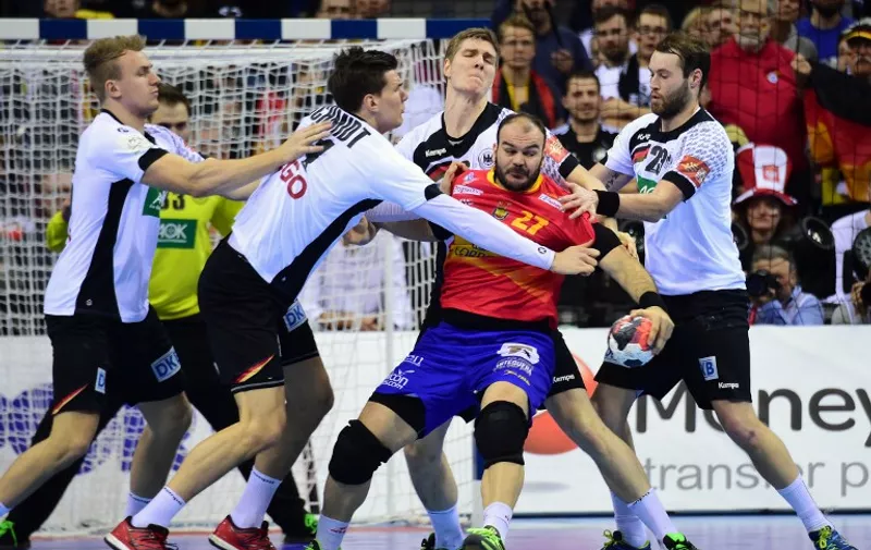 Rafael Baena González (C-R) of Spain fights for the ball with Rune Dahmke (L), Erik Schmidt (2nd L), Hendrik Pekeler (C-L) and Steffen Fäth (R) of Germany during the final match of the Men's 2016 EHF European Handball Championship between Germany and Spain in Krakow on January 31, 2016.  / AFP / ATTILA KISBENEDEK