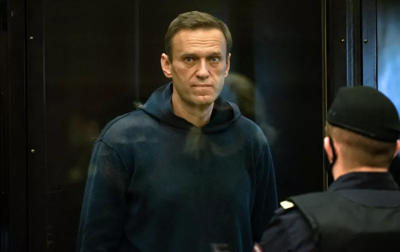 (FILES) In this file photo taken on February 02, 2021 Russian opposition leader Alexei Navalny, charged with violating the terms of a 2014 suspended sentence for embezzlement, stands inside a glass cell during a court hearing in Moscow. - EU foreign ministers will discuss the case of Alexei Navalny when they hold talks on April 19, 2021, Germany said, as fears grew of the hunger-striking Kremlin critic's deteriorating health while he is being held in a Russian penal colony. (Photo by Handout / Moscow City Court press service / AFP) / RESTRICTED TO EDITORIAL USE - MANDATORY CREDIT "AFP PHOTO / Moscow City Court press service / handout" - NO MARKETING - NO ADVERTISING CAMPAIGNS - DISTRIBUTED AS A SERVICE TO CLIENTS