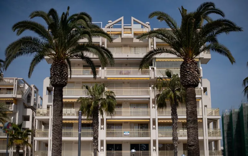 A picture shows an apartment building in Salou near Tarragona on March 12, 2020. Since the COVID-19 coronavirus outbreak began in China, it has been the elderly who are most vulnerable to the effects of the virus. Last week, Madrid health officials closed elderly day-care centres after a cluster of infections, with a top health official suggesting it was unwise for children to stay with their grandparents. (Photo by Josep LAGO / AFP)