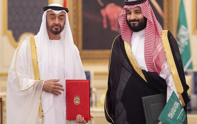 JEDDAH, SAUDI ARABIA - JUNE 07: (----EDITORIAL USE ONLY  MANDATORY CREDIT - "BANDAR ALGALOUD / SAUDI KINGDOM COUNCIL / HANDOUT" - NO MARKETING NO ADVERTISING CAMPAIGNS - DISTRIBUTED AS A SERVICE TO CLIENTS----) Saudi Arabian Crown Prince Mohammed bin Salman Al Saud (R) and Crown Prince of Abu Dhabi Sheikh Mohammed bin Zayed Al Nahyan (L) are seen after signing Saudi-UAE cooperation agreements during the first meeting of the Saudi-Emirati Coordination Council in Jeddah, Saudi Arabia on June 07, 2018. Bandar Algaloud / Saudi Kingdom Council / Handout / Anadolu Agency (Photo by Bandar Algaloud / Saudi Kingdom / ANADOLU AGENCY / Anadolu Agency via AFP)