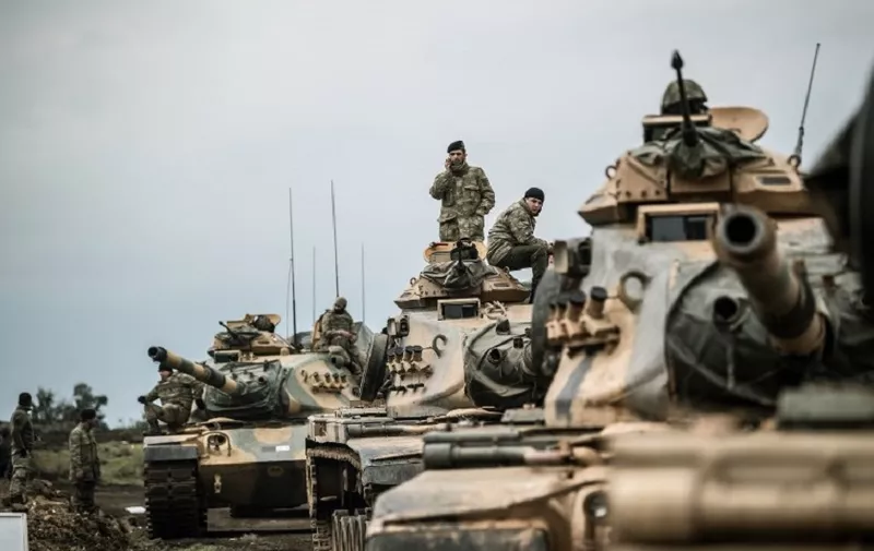 Turkish army tanks gather close to the Syrian border on January 21, 2018 at Hassa, in Hatay province. 
Turkish forces on January 20, 2018, began a major new operation aimed at ousting the Peoples' Protection Units (YPG) Kurdish militia from Afrin, pounding dozens of targets from the sky in air raids and with artillery. Turkey accuses the YPG of being the Syrian offshoot of the Kurdistan Workers' Party (PKK) which has waged a rebellion in the Turkish southeast for more than three decades and is regarded as a terror group by Ankara and its Western allies.
 / AFP PHOTO / BULENT KILIC
