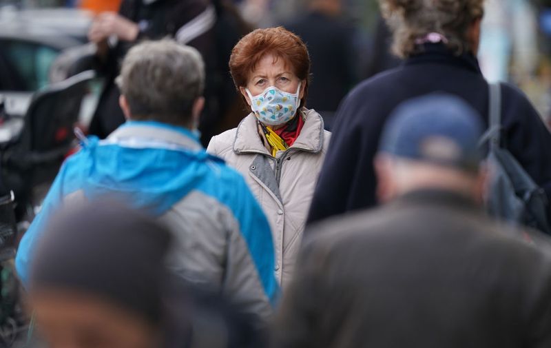 BERLIN, GERMANY - OCTOBER 16: An elderly woman, who said she did not mind being photographed, wears a protective face mask while walking in Kreuzberg district during the coronavirus pandemic on October 16, 2020 in Berlin, Germany. Confirmed Covid-19 infection rates in Germany hit a new all time high with 7,334 cases reported nationwide yesterday, following similar trends in many countries across Europe as a "second wave" of infections seems to be fully underway. (Photo by Sean Gallup/Getty Images)