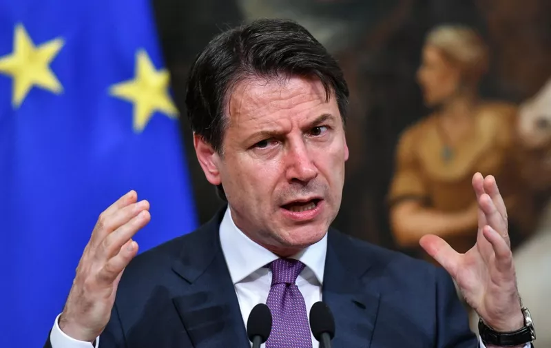 Italian Prime Minister Giuseppe Conte gestures as he speaks during a press conference at Chigi Palace in Rome on June 3, 2019. (Photo by Alberto PIZZOLI / AFP)