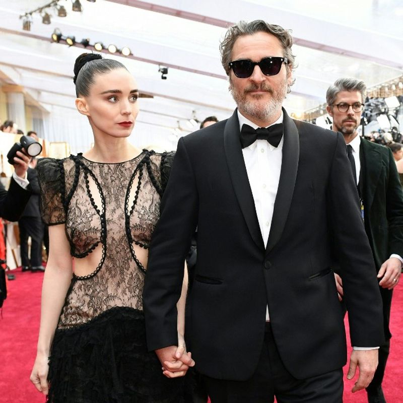 US actor Joaquin Phoenix arrives with Rooney Mara for the 92nd Oscars at the Dolby Theatre in Hollywood, California on February 9, 2020. (Photo by VALERIE MACON / AFP)