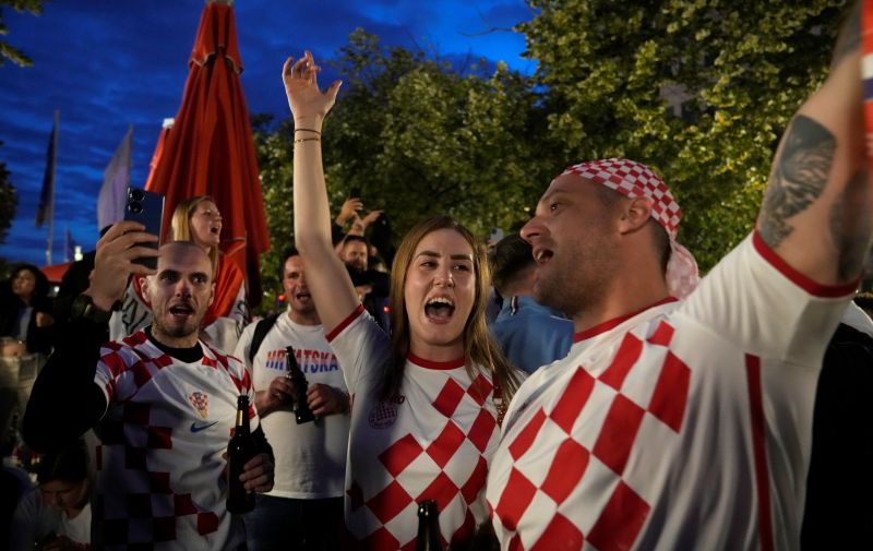 Croatian fans cheer during the Euro 2024 soccer tournament in Berlin, Germany, Friday, June 14, 2024. (AP Photo/Ebrahim Noroozi)