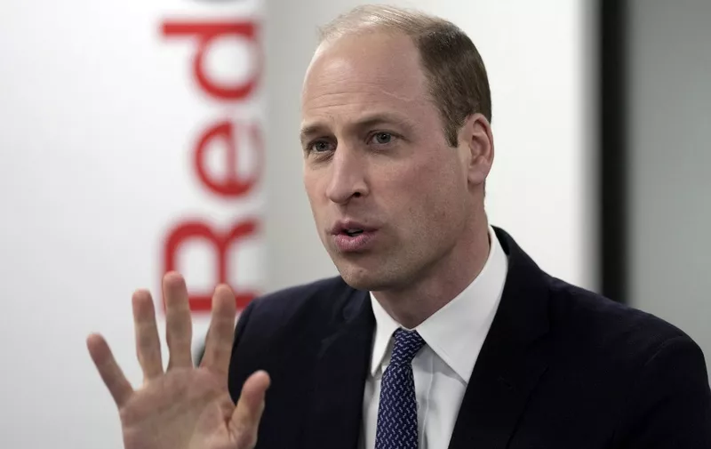Britain's Prince William, Prince of Wales reacts during a visit to the British Red Cross' headquarters in London on February 20, 2024. The Prince of Wales visit the British Red Cross to hear about the humanitarian efforts taking place to support those affected by the conflict in Middle East and in Gaza. (Photo by Kin Cheung / POOL / AFP)