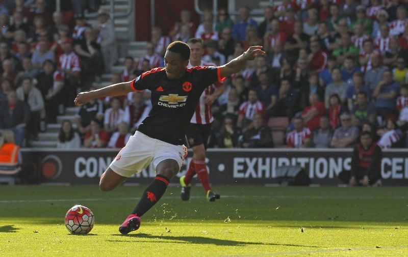 Manchester United's French striker Anthony Martial shoots to score their first goal during the English Premier League football match between Southampton and Manchester United at St Mary's Stadium in Southampton, southern England on September 20, 2015. AFP PHOTO / IAN KINGTON

RESTRICTED TO EDITORIAL USE. No use with unauthorized audio, video, data, fixture lists, club/league logos or 'live' services. Online in-match use limited to 75 images, no video emulation. No use in betting, games or single club/league/player publications.