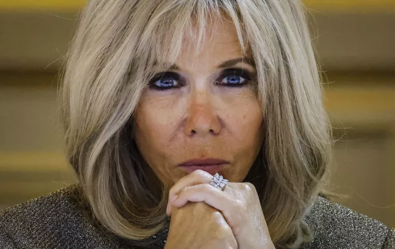 French President's wife Brigitte Macron reacts during a dinner at the Elysee Palace in Paris on September 30 2021 as part of the closing ceremony of the Africa2020 season, which presented the views of the civil society from the African continent and its recent diaspora in different sectors of activity. - The Season 2020 focused on innovation in the arts, sciences, technology, entrepreneurship and the economy. (Photo by Ludovic MARIN / AFP)