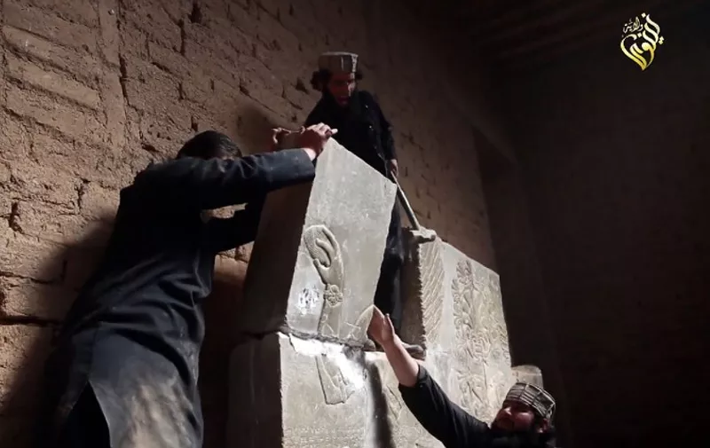 TO GO WITH AFP STORY BY ALICE RITCHIE
(FILES) In this image grab taken from a video on April 11, 2015 and made available by Jihadist media outlet Welayat Nineveh allegedly shows members of the Islamic State (IS) militant group destroying a stoneslab with a sledgehammer at what they said was the ancient Assyrian city of Nimrud in northern Iraq. As armed groups in Syria and Iraq destroy priceless archaeological sites, European authorities and dealers are on high alert for smaller, looted artefacts put on sale to help finance the jihadists' war.
AFP PHOTO / HO / WELAYAT NINEVEH
=== RESTRICTED TO EDITORIAL USE - MANDATORY CREDIT "AFP PHOTO / HO / WELAYAT NINEVEH" - NO MARKETING NO ADVERTISING CAMPAIGNS - DISTRIBUTED AS A SERVICE TO CLIENTS FROM ALTERNATIVE SOURCES, AFP IS NOT RESPONSIBLE FOR ANY DIGITAL ALTERATIONS TO THE PICTURE'S EDITORIAL CONTENT, DATE AND LOCATION WHICH CANNOT BE INDEPENDENTLY VERIFIED ===