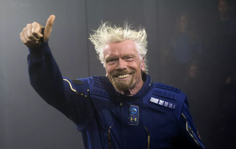 Virgin Galactic Founder Sir Richard Branson demonstrates a spacewear system, designed for Virgin Galactic astronauts, at an event October 16, 2019 in Yonkers, New York. - At the event Virgin Galactic and Under Armour unveiled the worlds first exclusive spacewear system for private astronauts. (Photo by Don Emmert / AFP)